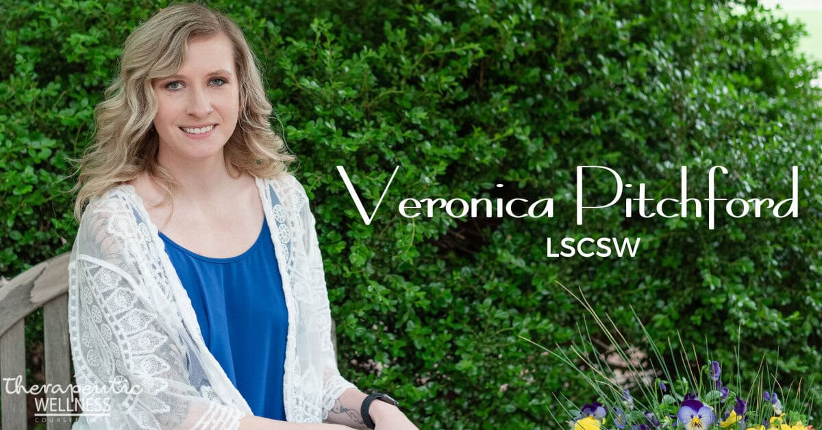 A woman with wavy blonde hair, wearing a blue top and white lace cardigan, sits on a bench near green bushes. Text reads: &ldquo;Veronica Pitchford, LSCSW.&rdquo; A bouquet of flowers and &ldquo;Therapeutic Wellness&rdquo; highlight Veronica Pitchford&rsquo;s practice.