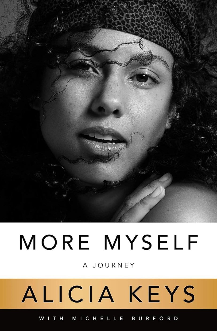 Black and white cover of the book "More Myself: A Journey" by Alicia Keys with Michelle Burford, featuring a close-up of Alicia Keys&rsquo; untamed curly hair partially covering her face.