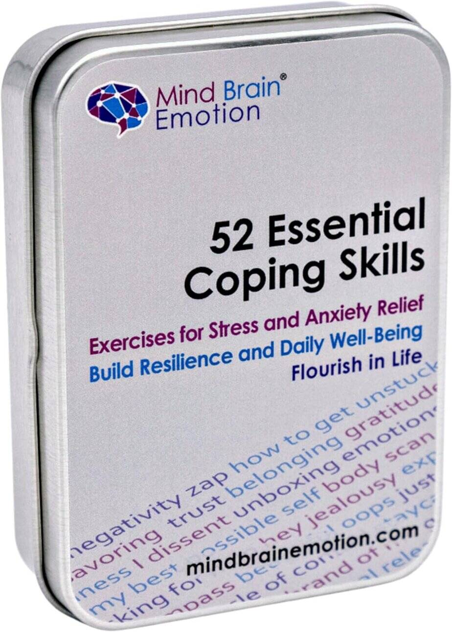 A metal tin labeled "52 Essential Coping Skills," featuring stress and anxiety relief exercises, resilience tips, and self-care dice activities for well-being. The branding "Mind Brain Emotion" appears at the top.